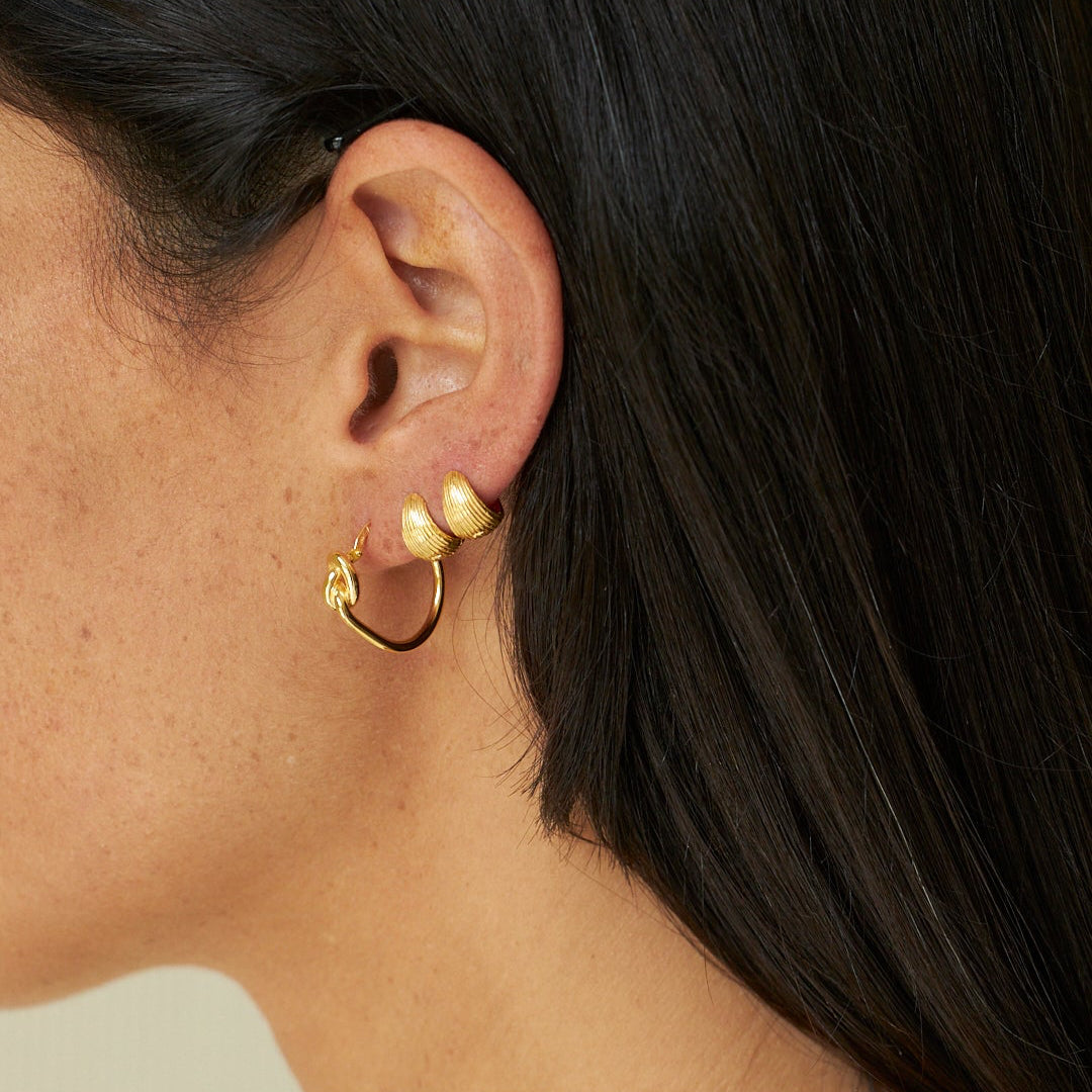 how to style minimalist gold jewelry with unique hoop earrings