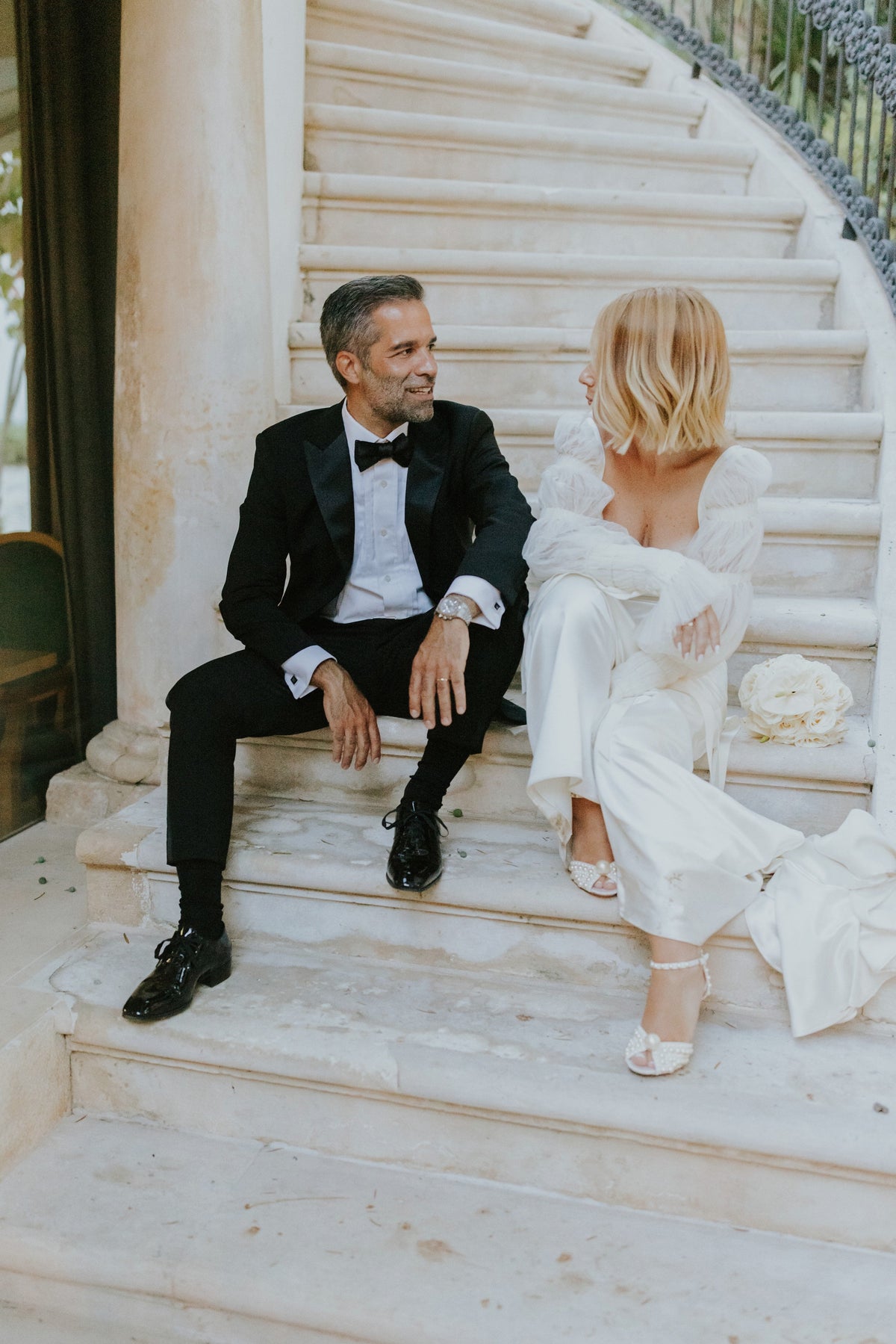 Minimal wedding earrings for modern brides complement elegant bridal looks in a romantic setting.
