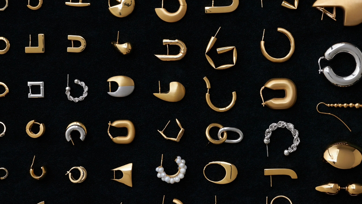 various styles of gold hoop earrings showcased in the CINCO Jewelry guide to gold hoop earrings guide