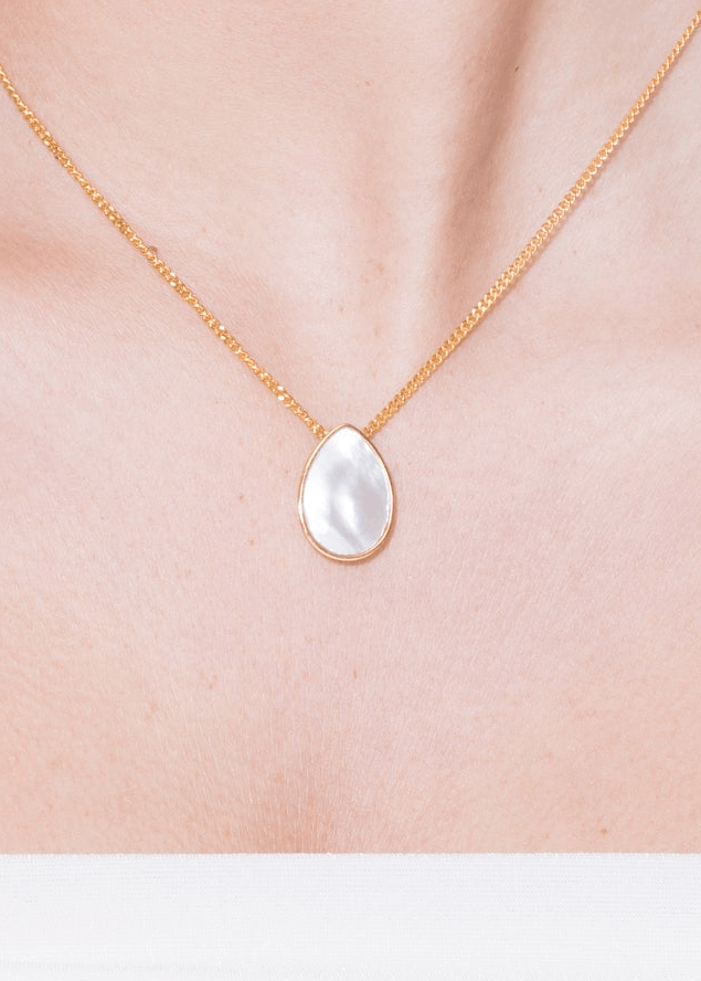 Klein Pearl Double Side Necklace with a pear-shaped pearl pendant on a delicate gold chain.