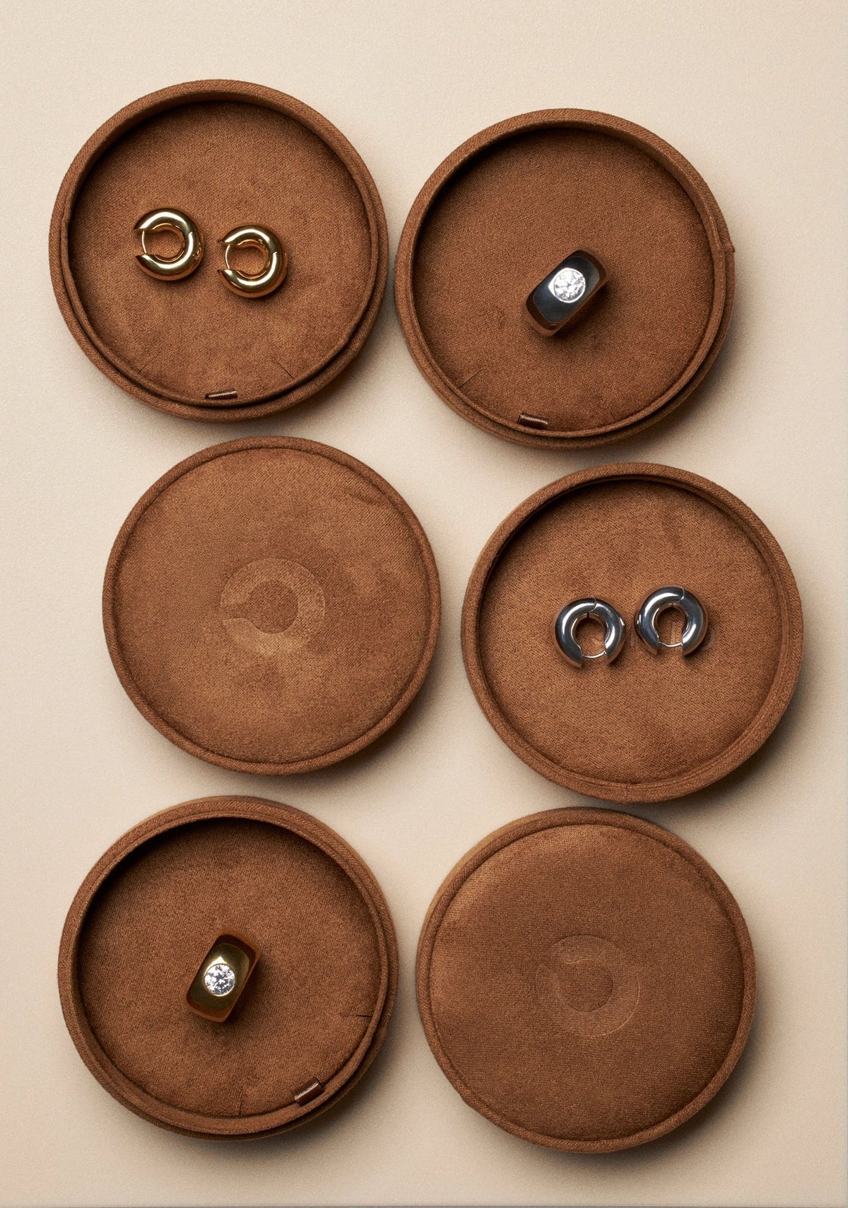 elegant jewelry for guests displayed in velvety round trays