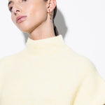 model wearing elin linked earrings in gold