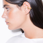 model wearing monet earcuff in gold