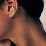 model wearing monet earcuff in gold
