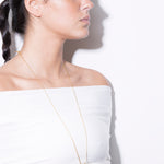 model wearing allegra necklace in gold