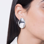model wearing gilberte earrings in silver
