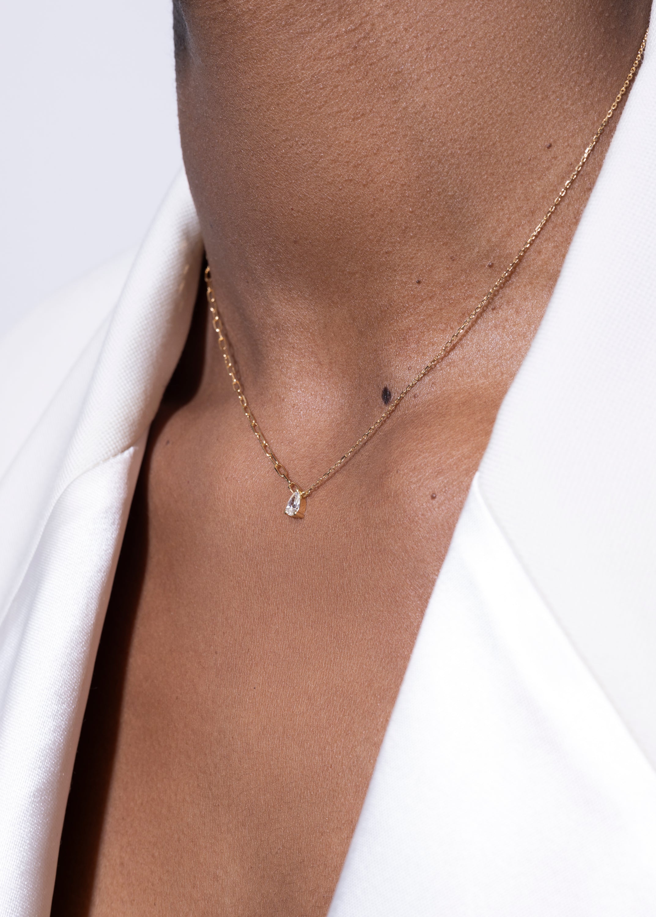 model wearing pear necklace 18k diamond