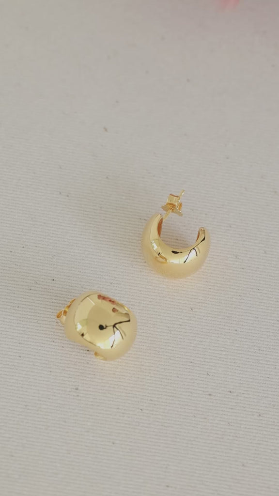 Model using gina earrings in gold 