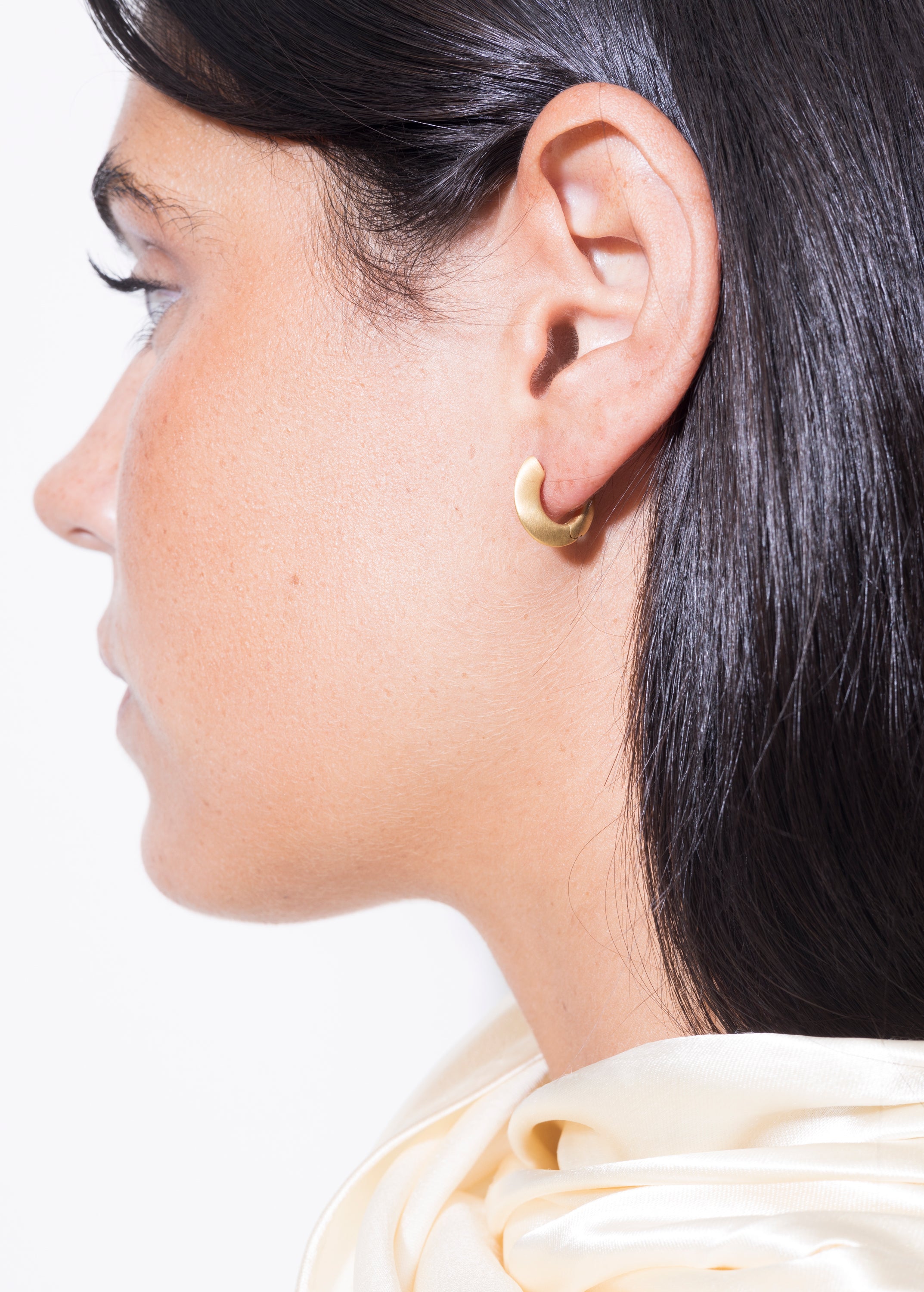 model wearing sarah mini earrings in gold